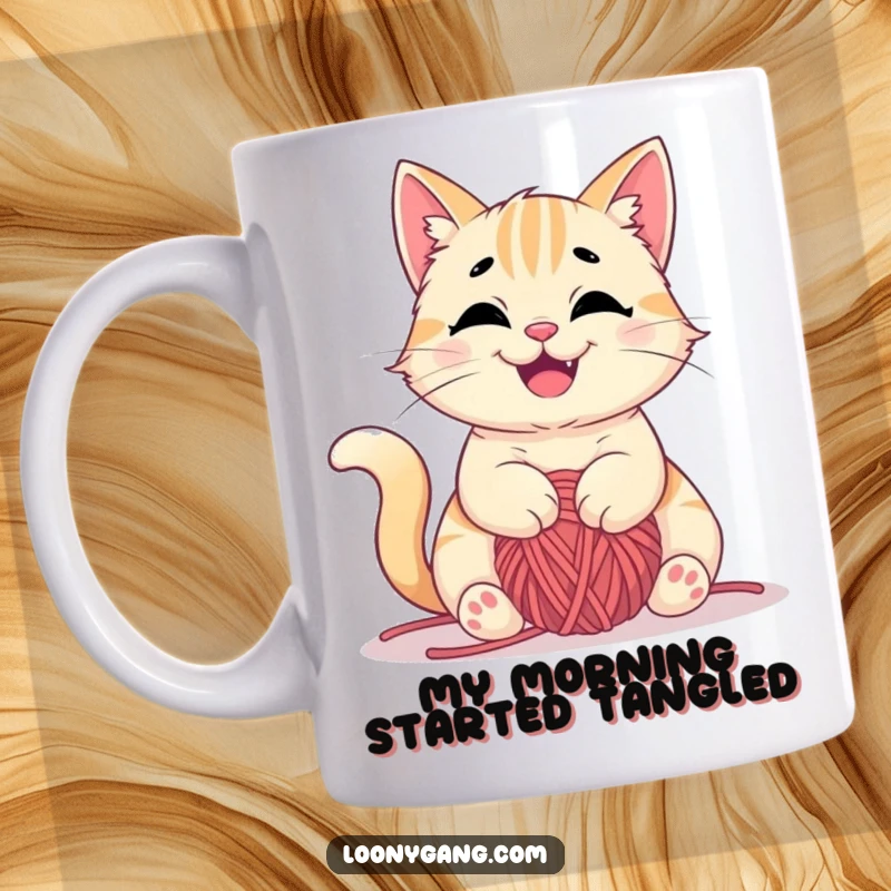 Funny mug featuring a mischievous cat happily tangled in a ball of yarn, playful and cute, great funny gift.