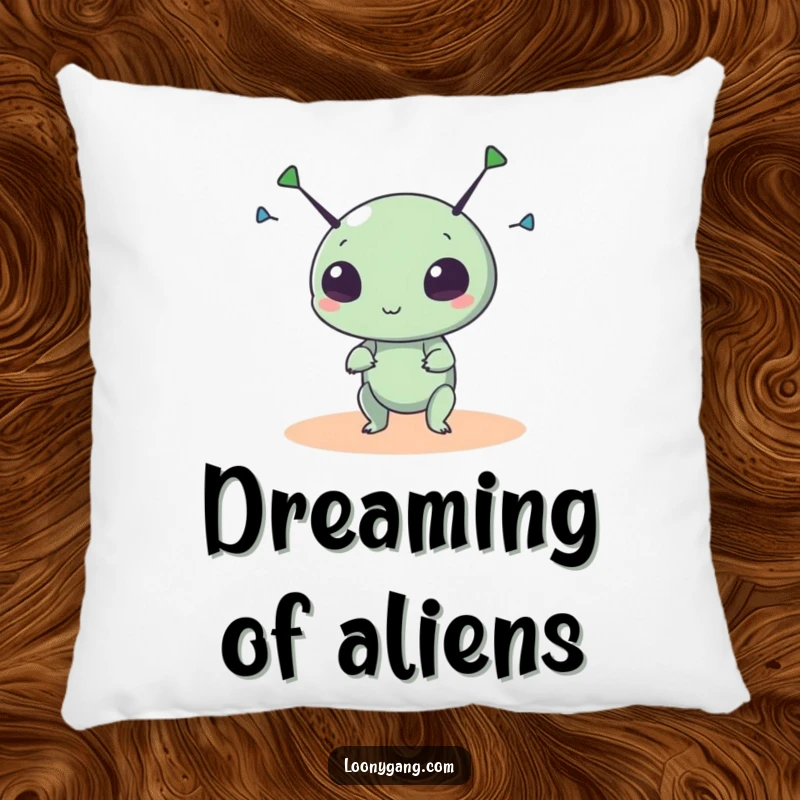 Funny alien pillow with a small, round creature spinning its antennae wildly, offering comfort and a touch of cosmic fun.