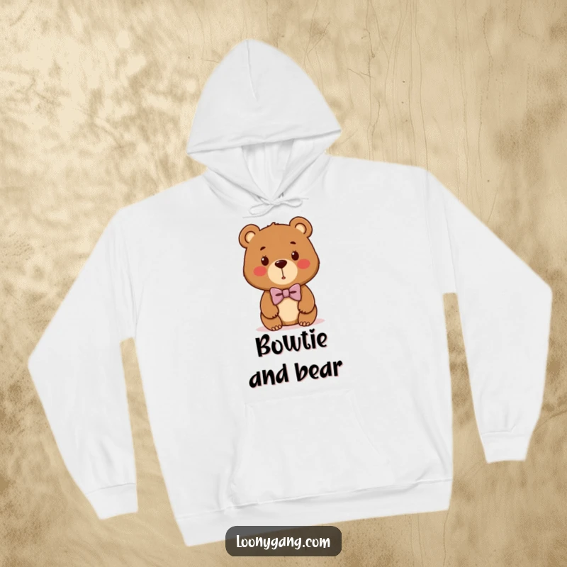 Funny bear cub hoodie featuring a cute brown bear sporting a hilariously crooked bowtie, blending comfort with comical elegance.