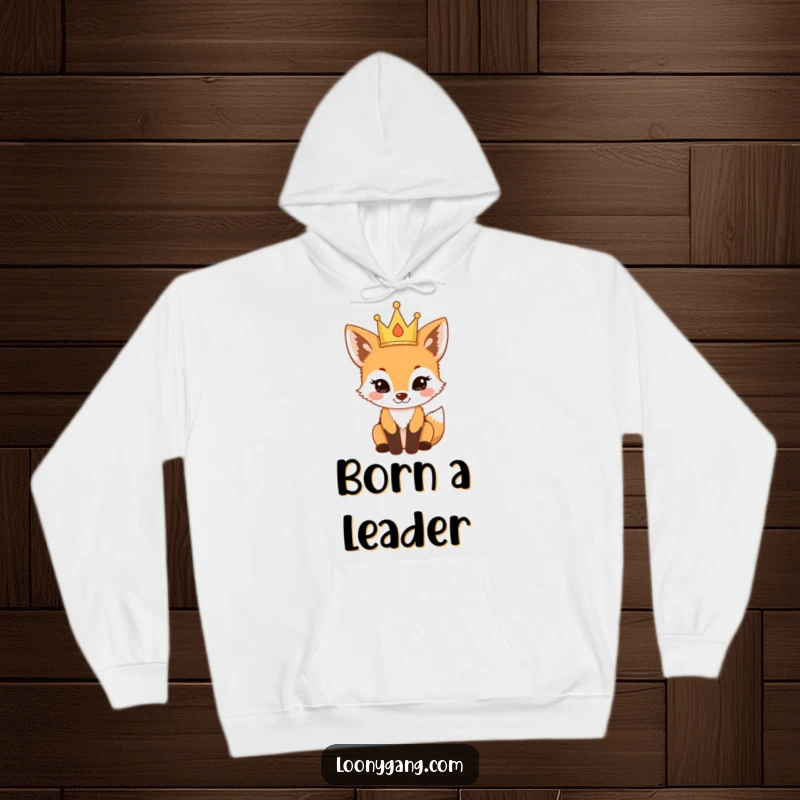 Funny fox cub wearing a tiny crown and looking proud in a cozy hoodie, a warm and funny gift.