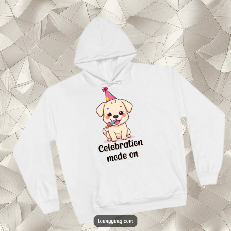 Funny hoodie featuring a happy dog adorned with a tiny party hat, enthusiastically blowing a noisemaker, ready for fun.