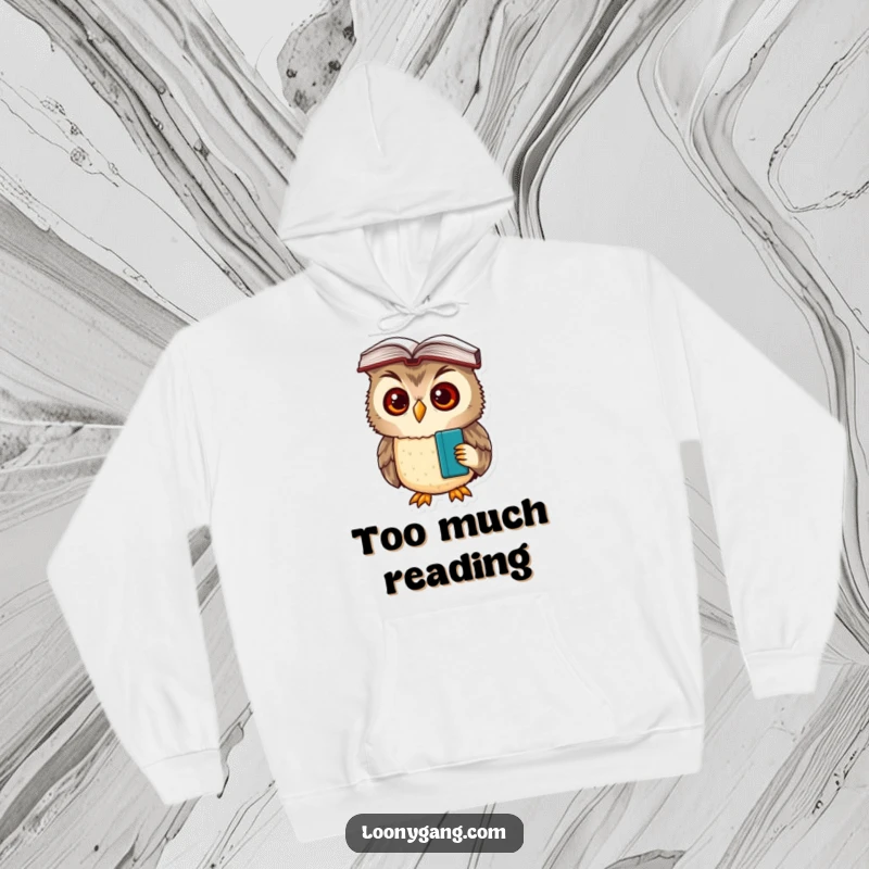 A comfortable hoodie featuring a funny, bewildered owl cub with a book resting on its head, looking thoughtfully confused.