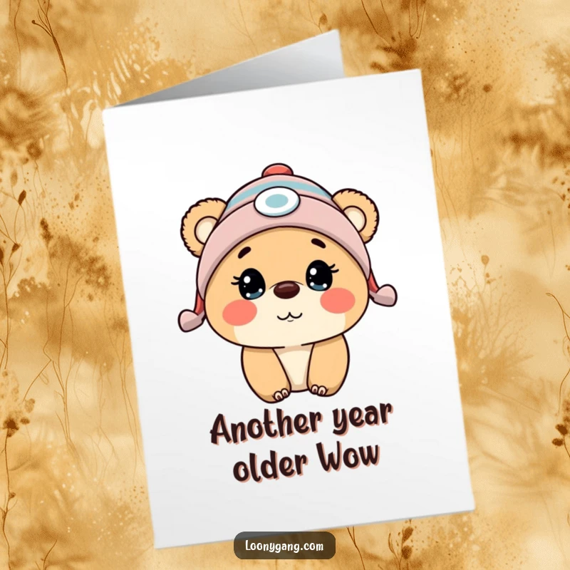 Funny Free Printable Birthday Card featuring a surprised bear cub in a propeller beanie, ready for a laugh.