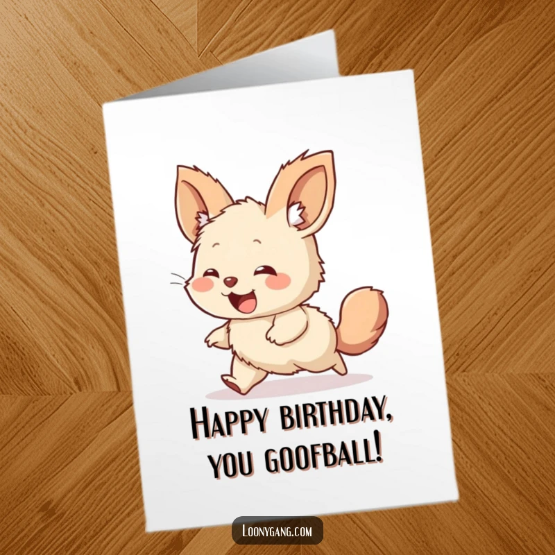 Funny Free Printable birthday card with a giggling, large-eared furry creature joyfully chasing its own tail in circles.
