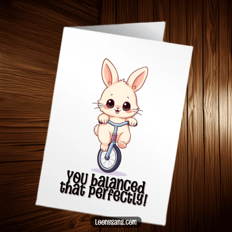 Funny Free Printable Congratulations card showing a fluffy rabbit with wide eyes precariously balancing on a unicycle.