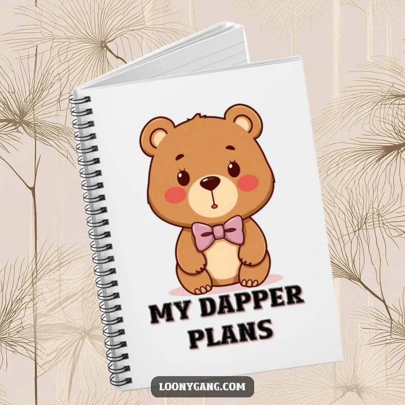 Funny bear cub notebook featuring a cute brown bear wearing a comically lopsided bowtie, ideal for jotting down ideas.