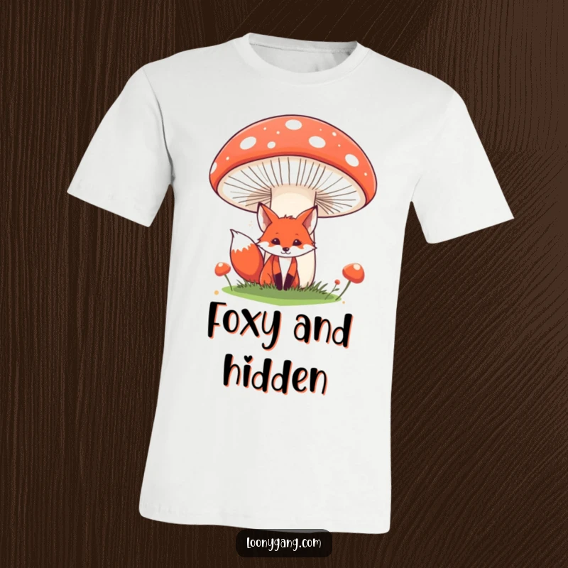 Funny fox t-shirt with a red fox playfully peeking from behind a large, comical mushroom. Great for those who love whimsical, nature-inspired, and funny animal shirts.