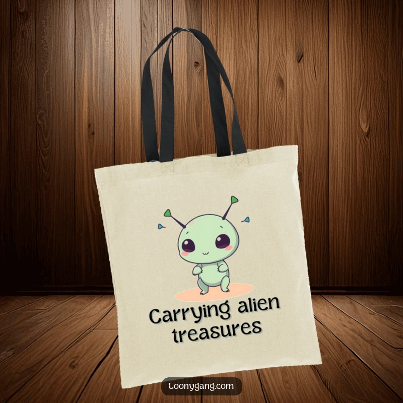 Funny alien tote bag with a small, round creature spinning its antennae wildly, perfect for carrying cosmic treasures.