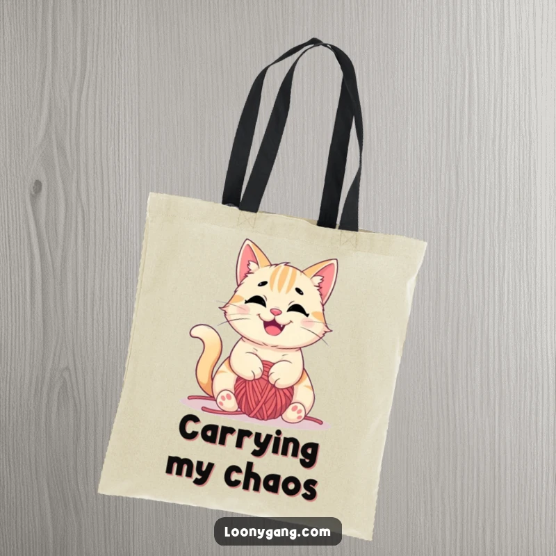 Funny tote bag featuring a mischievous cat happily tangled in yarn, perfect for craft supplies, great funny gift.