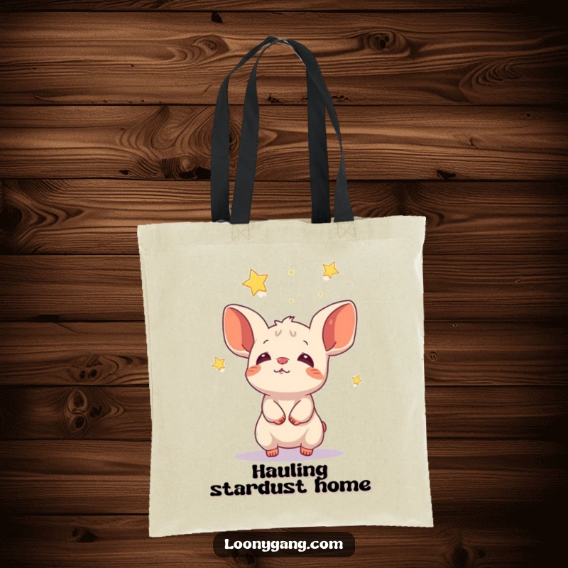 Funny animal with big ears catching falling stars, a whimsical tote bag for everyday use.